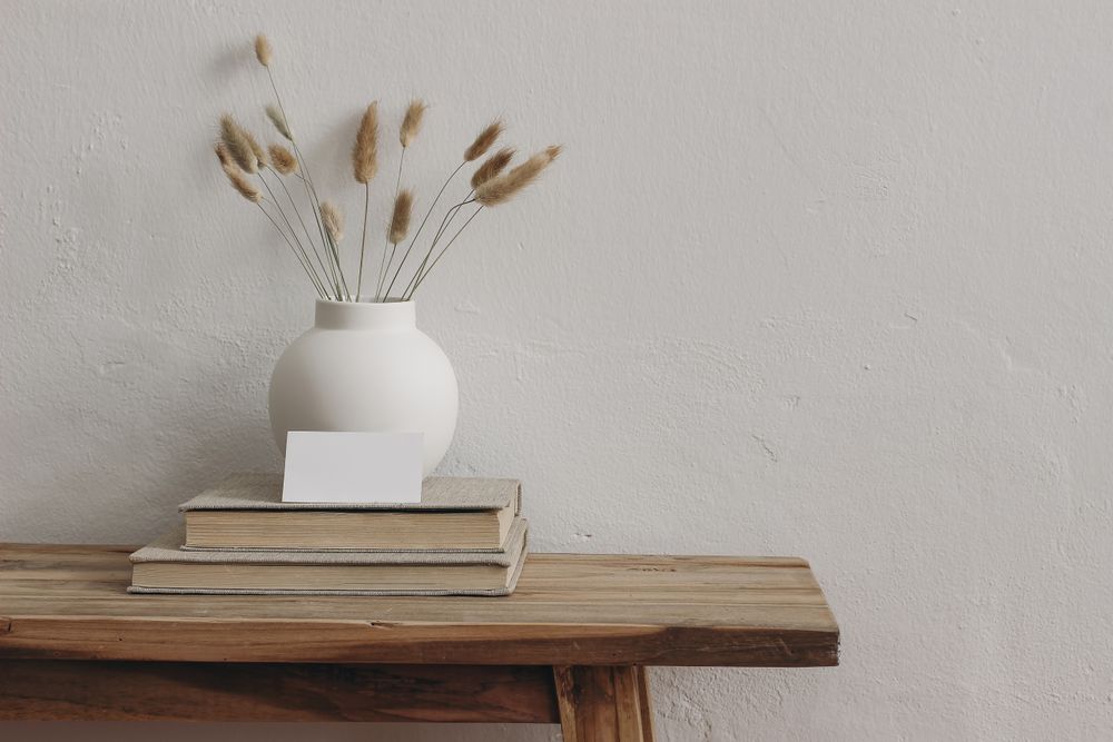 Blank business card mockup on old books