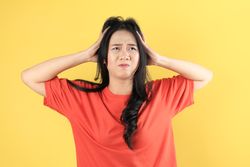 Young Asian Female Feeling Frustrated Nausea and Headache