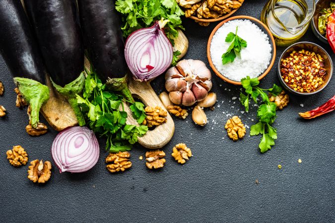 Top view of ingredients for cooking eggplant meal with space for text