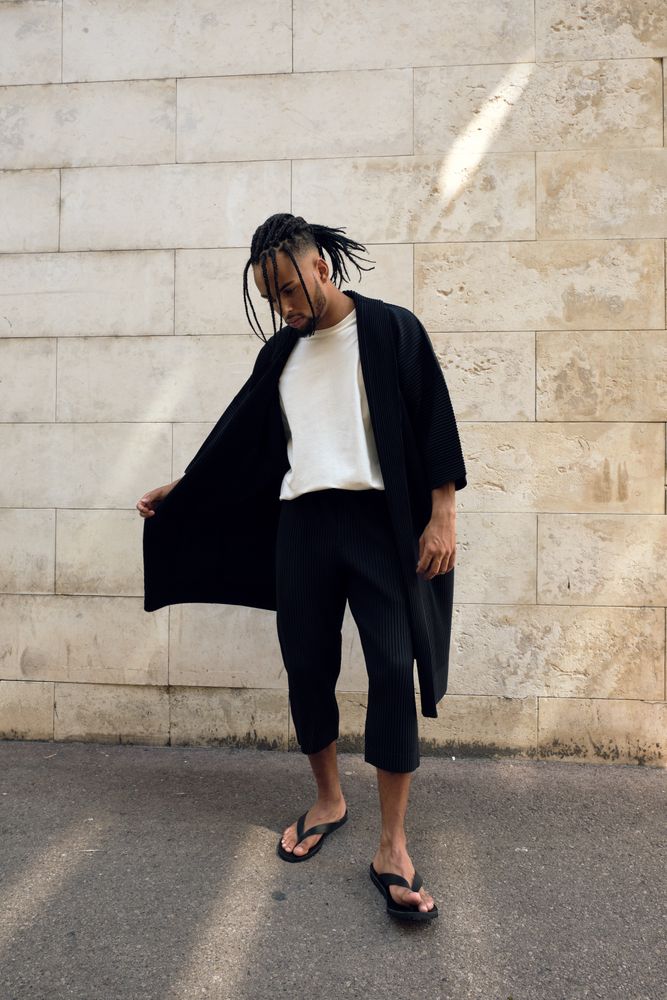 Trendy Black man posing on street
