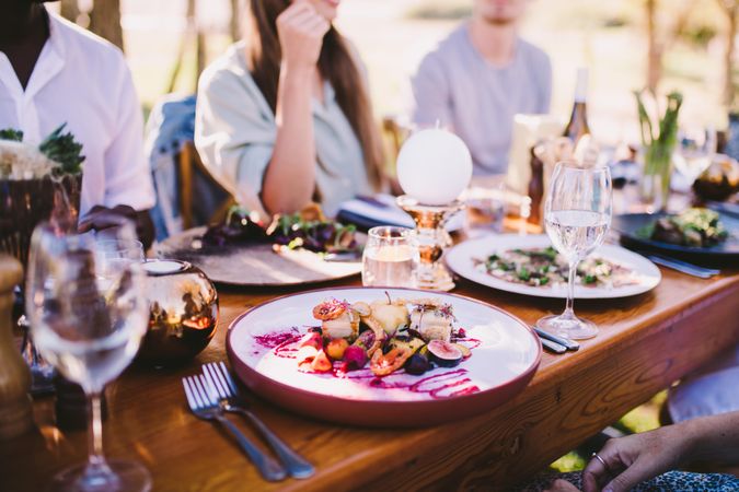 Formal outdoor table setting with entrée