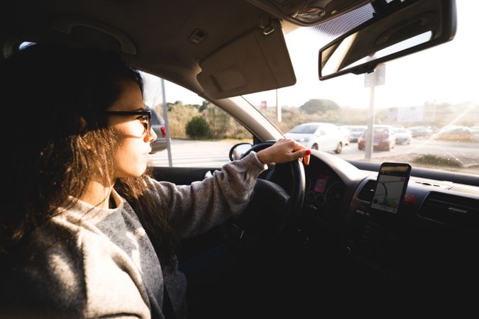 Young woman driving car