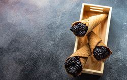 Blackberries in waffle cones