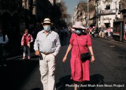Mexico City, Mexico - February 26th, 2022: Man and woman walking with crowd protesting bxO2a4