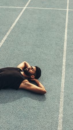 Top view of an athlete relaxing after a run