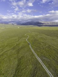 Drone shot of dirt road in the countryside