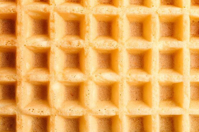 Belgian waffles texture as background, closeup