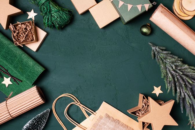 Flat lay of festive winter wrapping paper and items with copy space