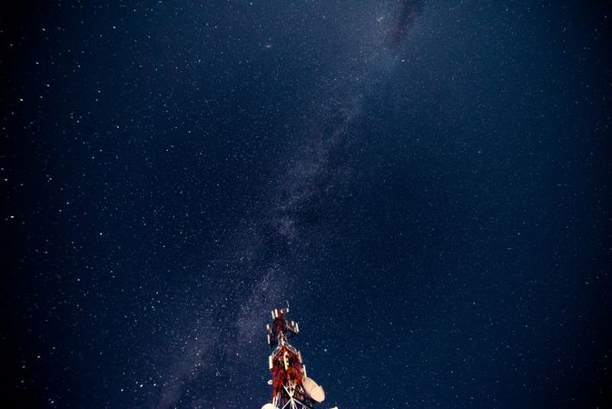 Radio tower against starry sky