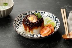 Indonesian breakfast of soy sauce chicken and rice
