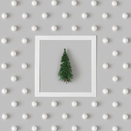 Holiday pattern with tree and snowballs on gray background