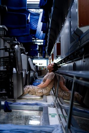 Military woman looking up inside vehicle