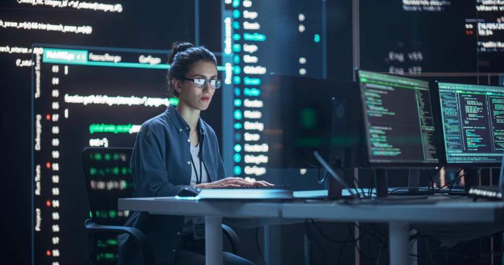 Portrait of Woman Creating a Software. Futuristic Coding Concept.