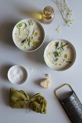 Kitchenware and condiments near asparagus cream soup