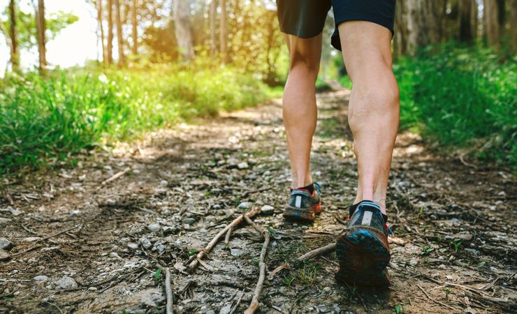 Feet of man participating in trail race