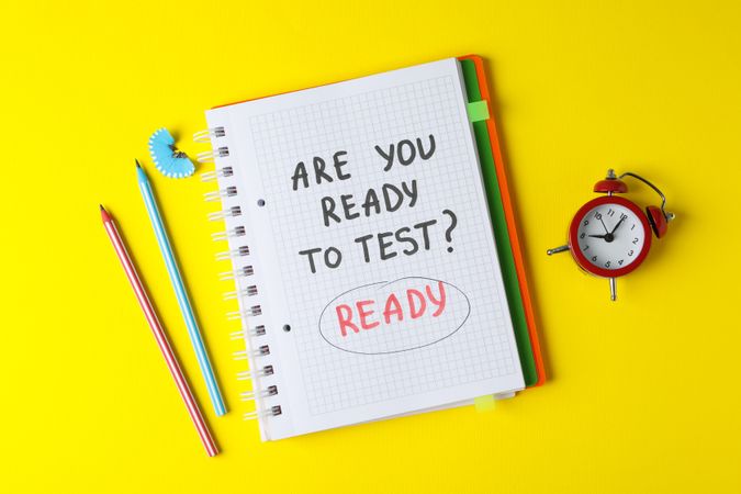 Open notebook with “are you ready to test” on yellow table