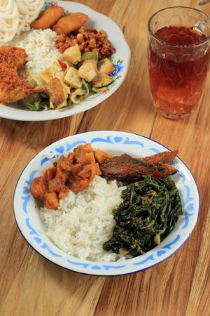 Nasi warteg, Indonesian meal with fried chicken and greens, served with tea