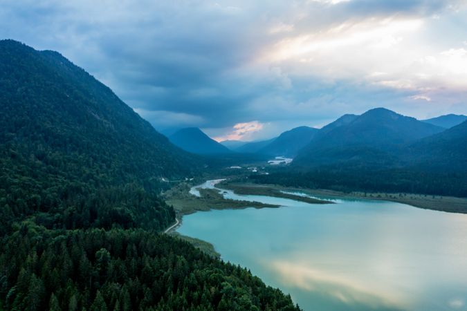 Drone shot at sunset in Isar Valley in Bavarian Alps, with the lake Sylvenstein surrounded by mountains