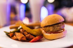 Plate with burger and yummy dish
