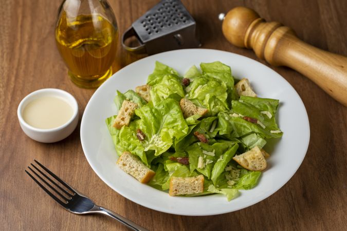 Caesar salad with croutons and bacon.