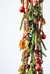 Christmas festive composition with pine, baubles and dried fruit slices