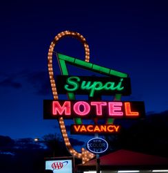 Retro neon sign for Supai Motel at dusk in Arizona PbYNX0