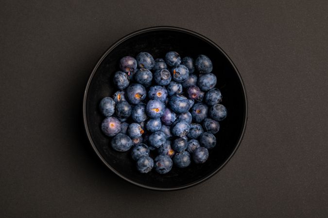 Bowl with ripe blueberries
