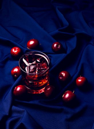 Red drink near fresh fruits
