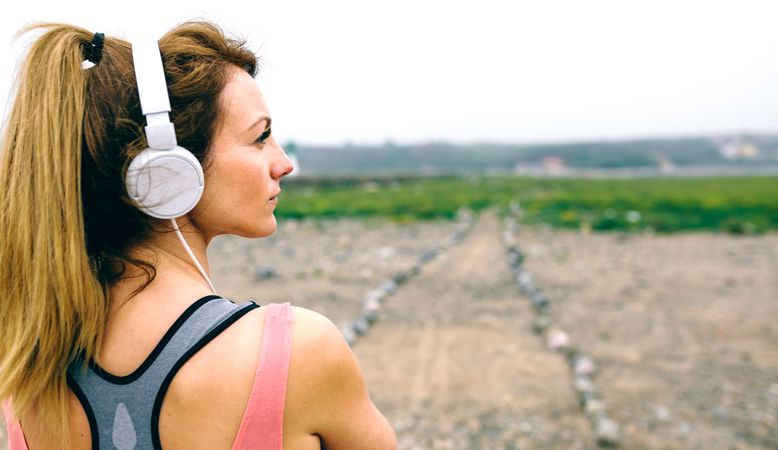Young sportswoman in front of path