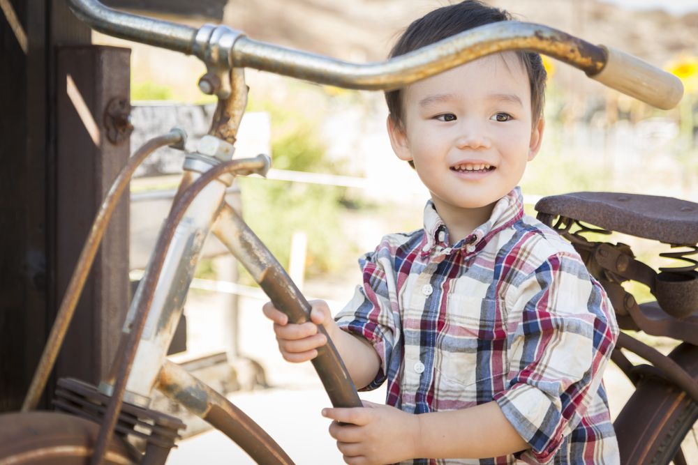 Smiling Young Boy Having Fun on the Bicycle
