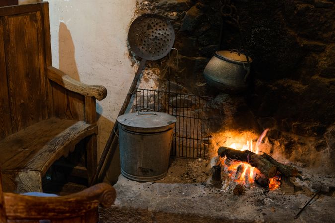 Kitchen with fireplace of ancient village cottage
