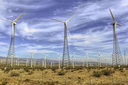Wind turbines under blue sky