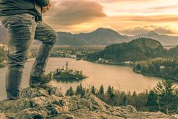 Man climbed on rocks at sunrise