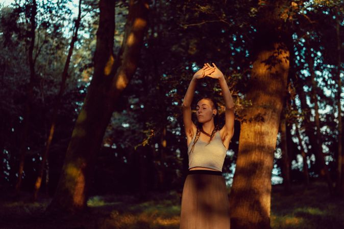 Young woman in majestic forest