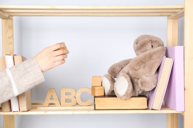 A children's book with toys on a light background.