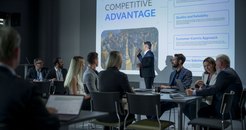 Corporate Event: Male Tech CEO Giving Presentation To Colleagues, Investors In Conference Room Of Innovative Startup Company Office.