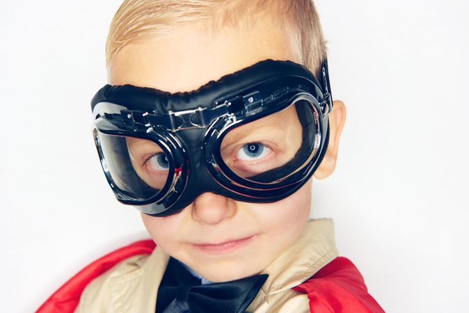 Close up of blond boy wearing airplane goggles