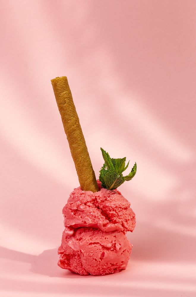 Strawberry ice cream scoops with waffle stick