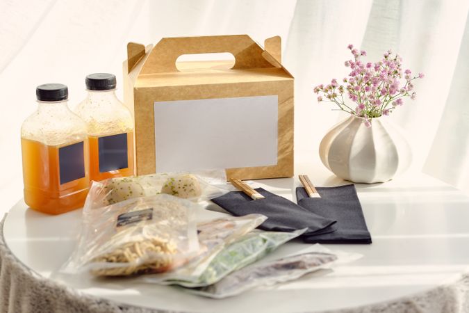 Vacuum sealed food placed on table near carton box