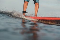 Man on surf board on water surface
