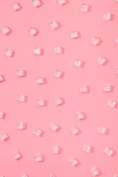 Ice cubes pattern on pastel pink background