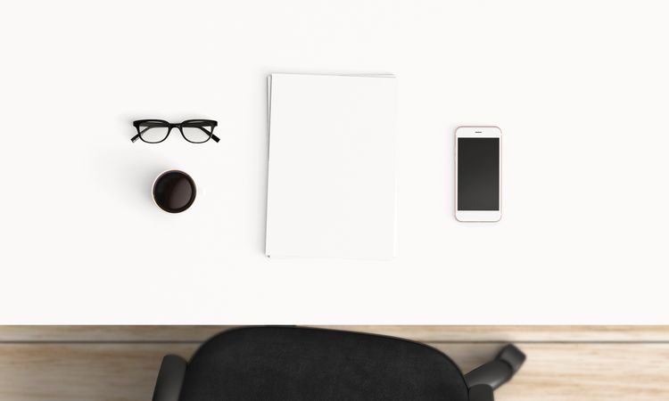 Modern workplace with coffee cup and smartphone or laptop copy space on office table background. Top view. Flat lay style