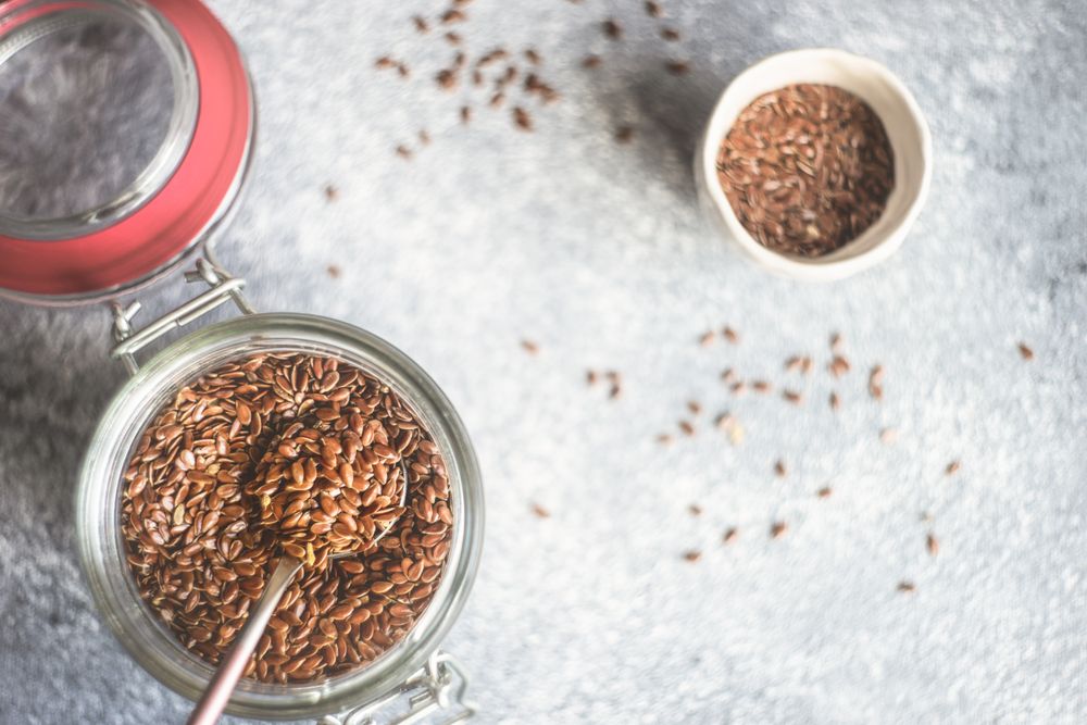 Top view of jar of whole flax seeds
