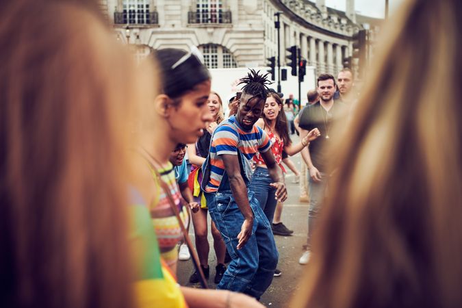 London, England, United Kingdom - July 7th, 2019: Man dancing at pride shot between the crowd