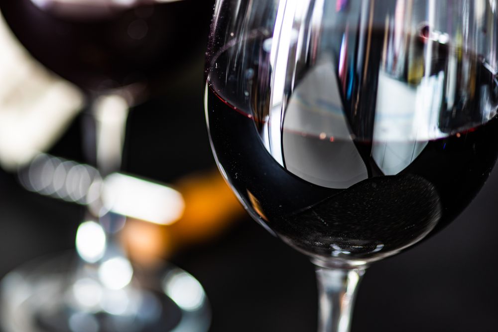 Red wine glass with selective focus