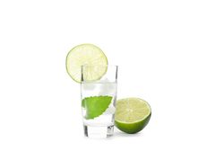 Tequila shot with lime, mint and ice isolated on blank background