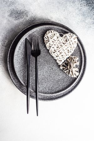 Place setting for St. Valentine Day with thatched heart decor