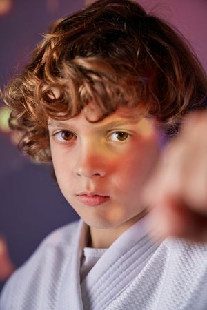 Serious boy in white kimono