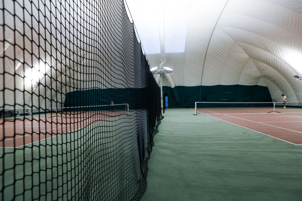 Man standing in tennis court