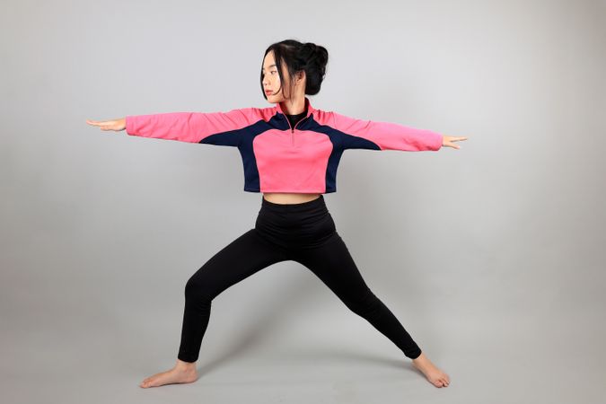 Young Woman doing Yoga Stretching Exercises